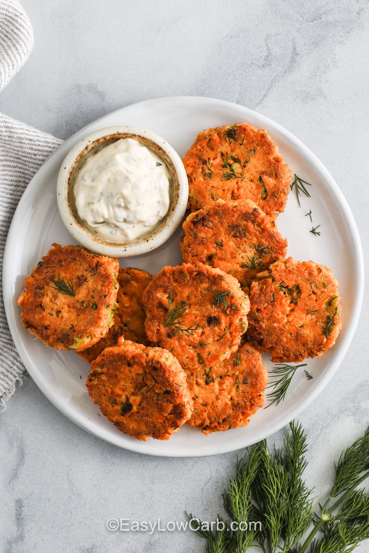 Looking down on Keto Salmon Patties on a plate with dip