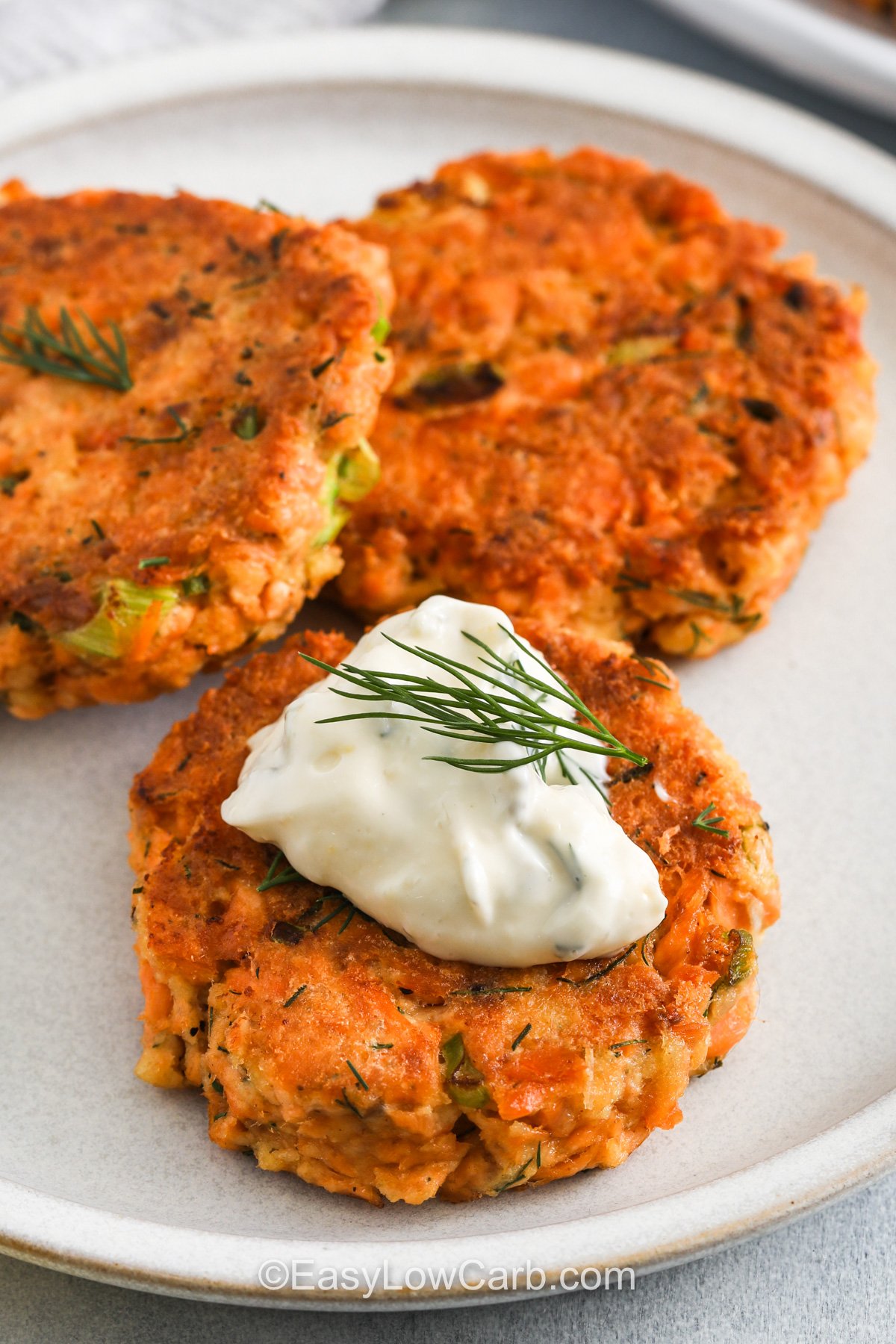 close up of Keto Salmon Patties with tartar sauce.