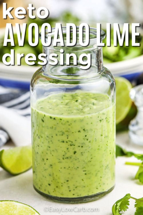 keto Avocado Lime Dressing in a jar with salt in the back and writing