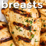 close up of Grilled Chicken Breasts on a plate with a title