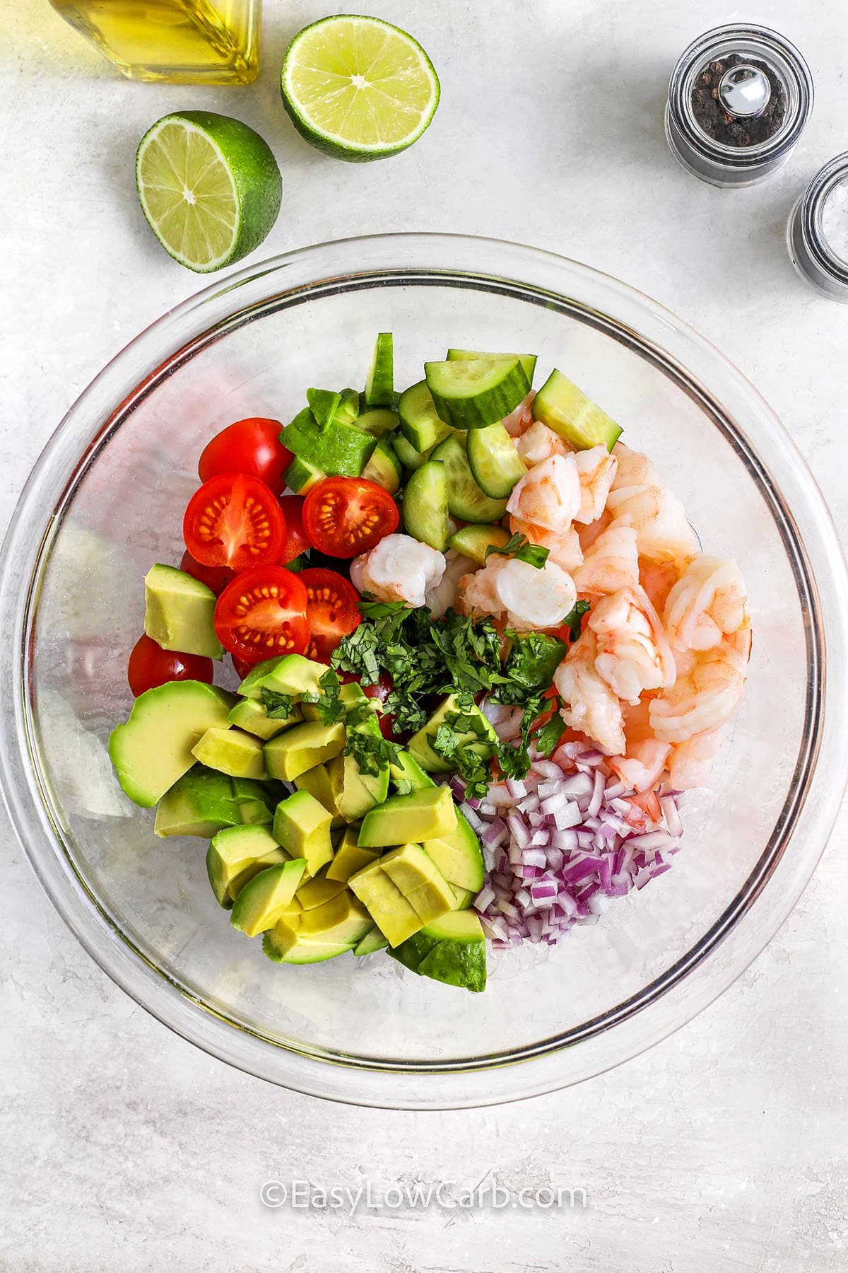 adding ingredients to bowl to make Shrimp Avocado Salad