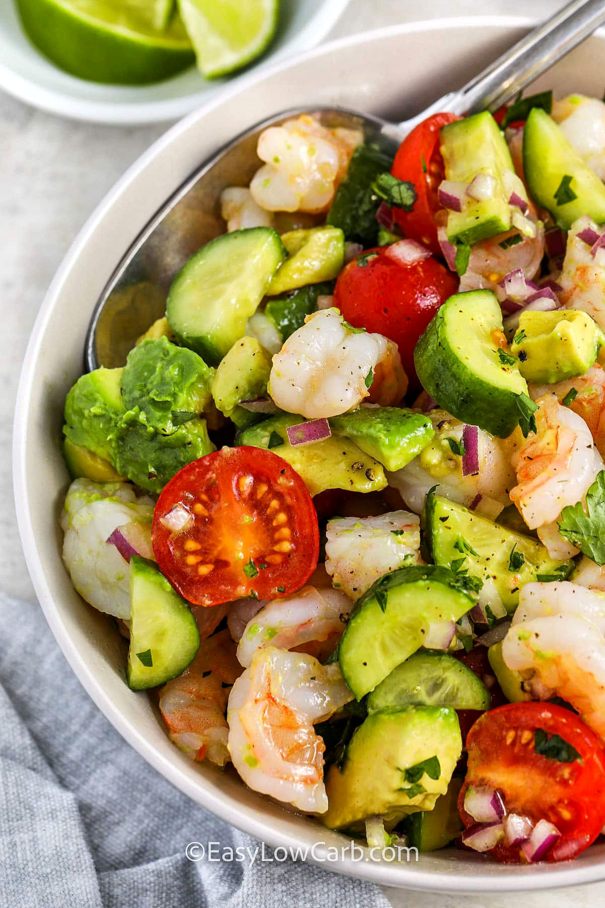 close up of plated Shrimp Avocado Salad with a spoon