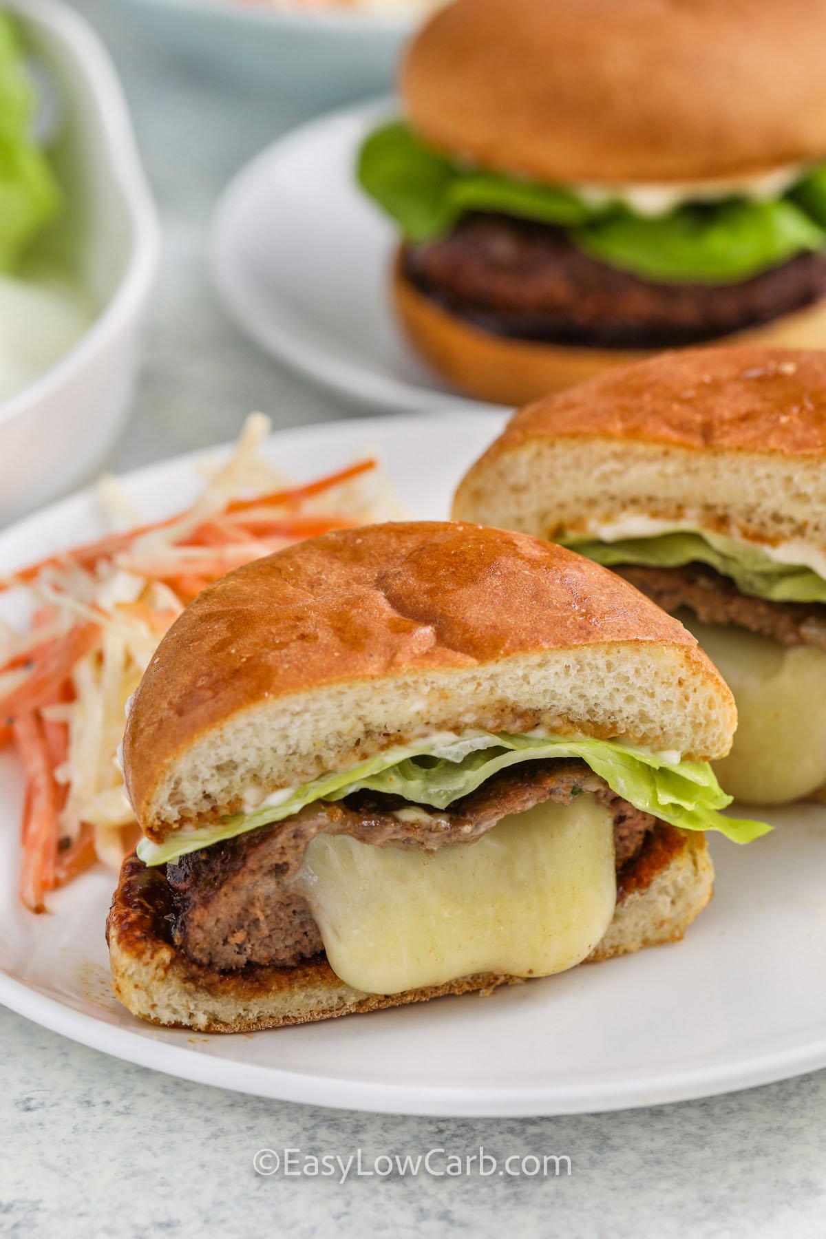 plated Cheese Stuffed Burgers with coleslaw