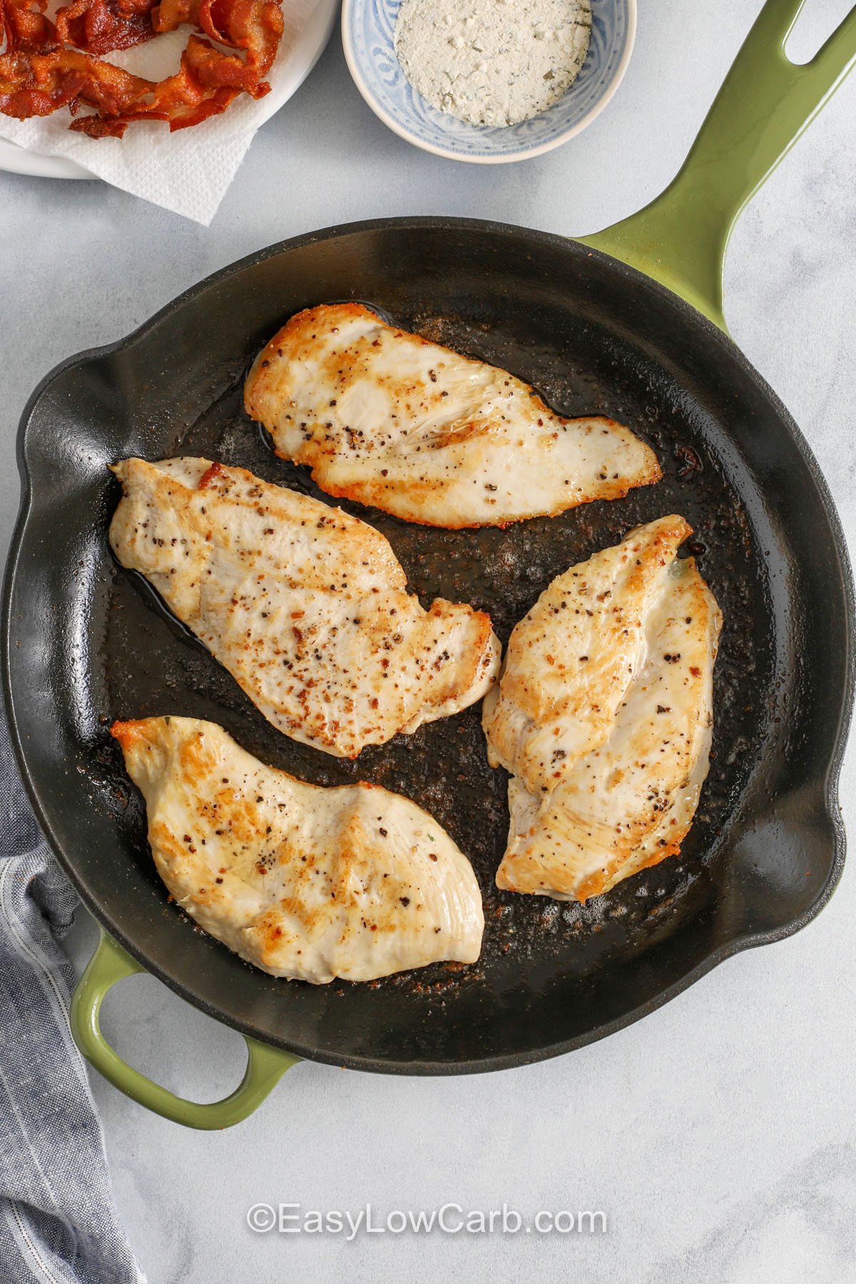 cooking chicken in bacon grease to make Bacon Ranch Chicken