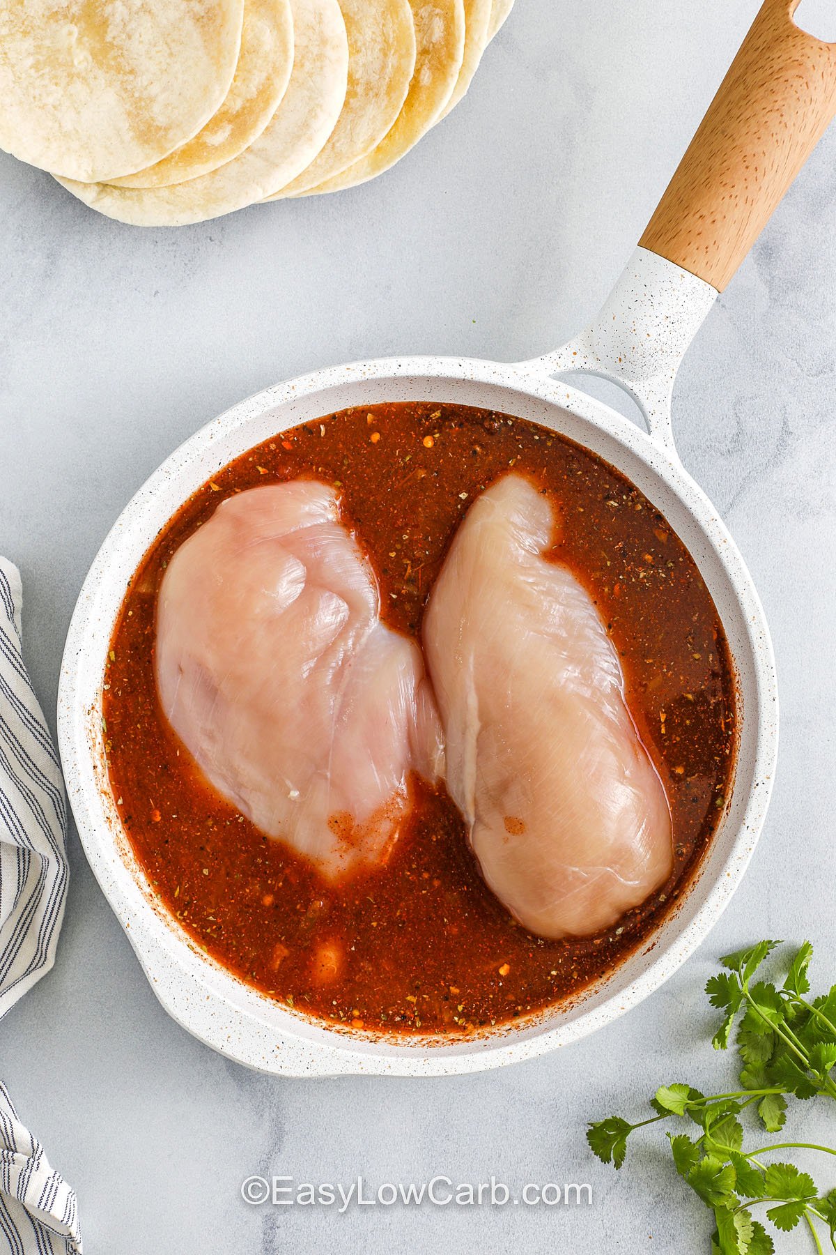 adding chicken to sauce in pan to make Recipe for Chicken Tacos