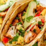 grilled fish tacos in low-carb tortillas with avocado garnish.