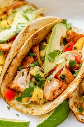 grilled fish tacos in low-carb tortillas with avocado garnish.