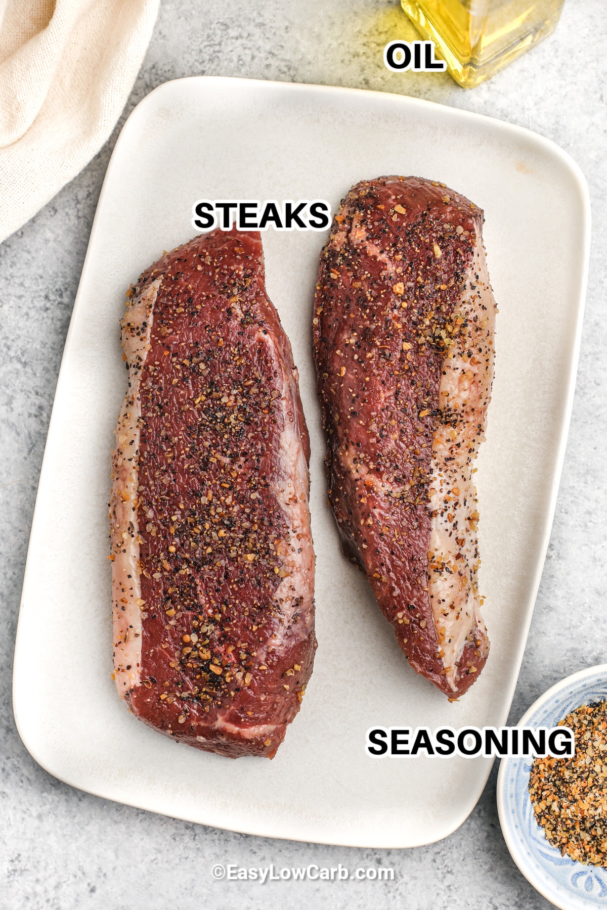 steaks , seasoning and oil with labels to make Grilled Sirloin Steak