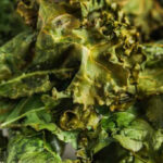 air fryer kale chips on a plate with text