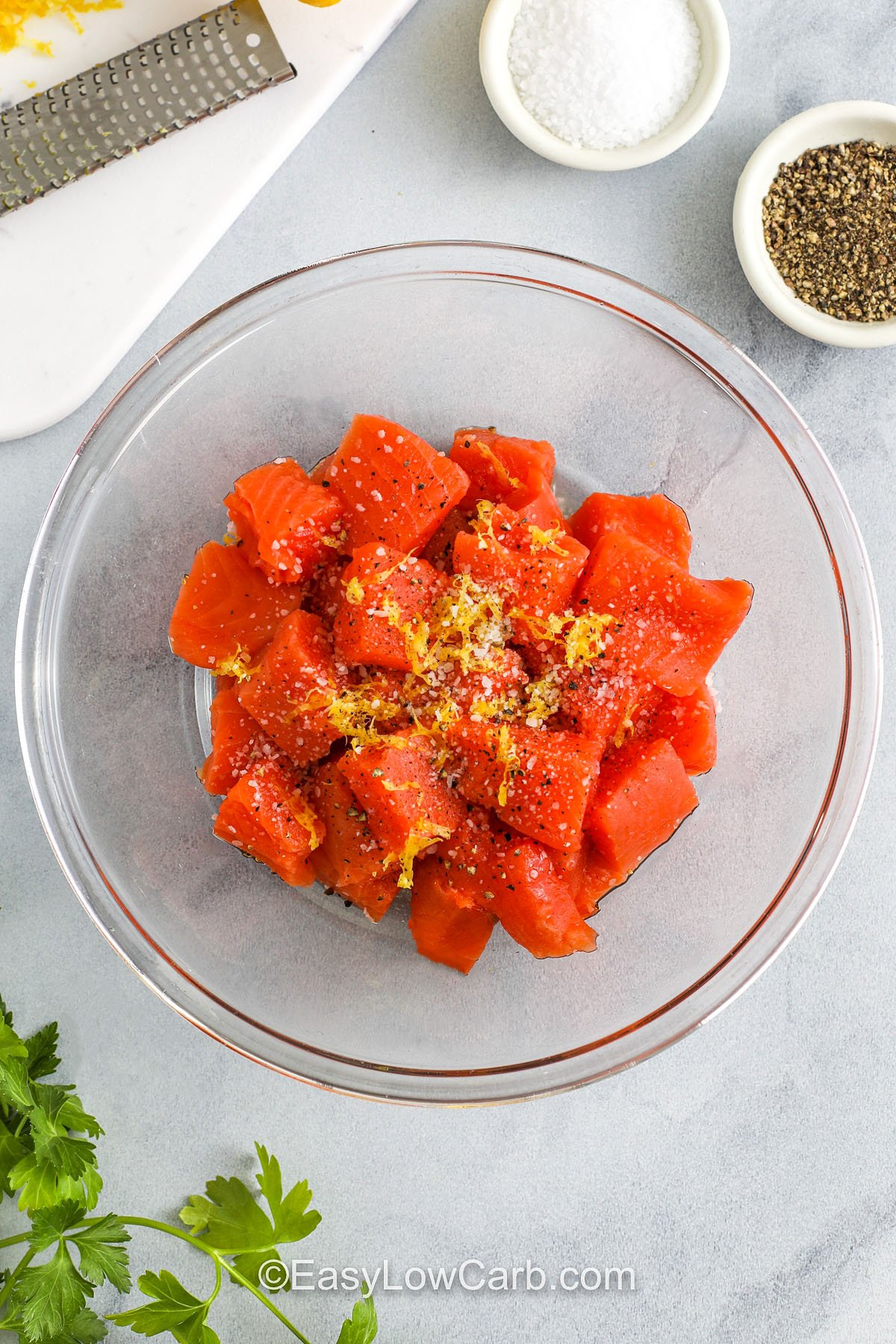 adding seasonings to salmon to make Salmon Bites Recipe