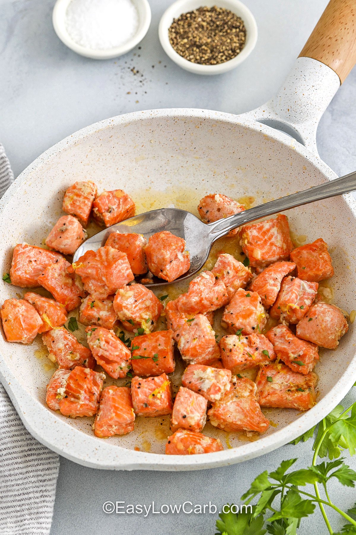 pan of Salmon Bites Recipe with a spoon