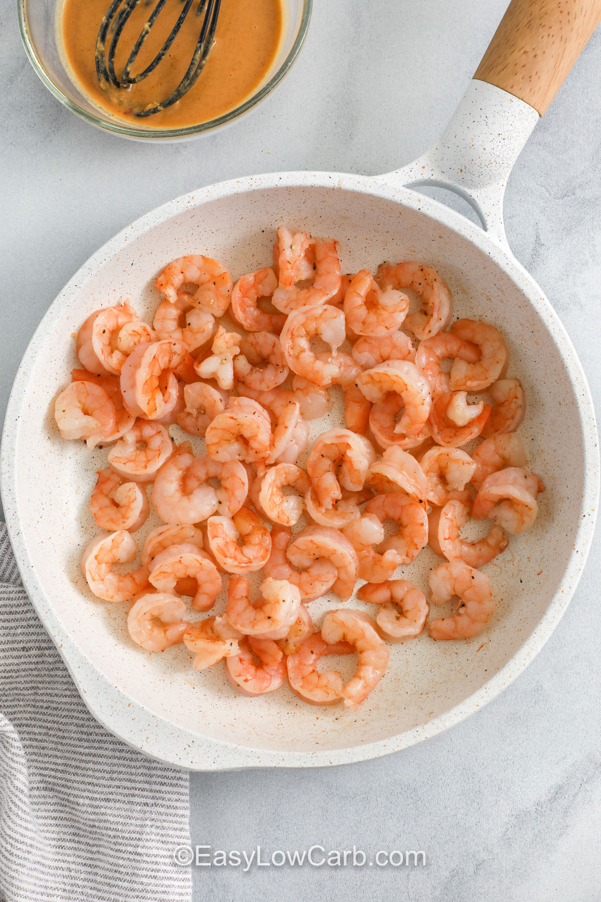 cooking shrimp in a pan to make Shrimp Lettuce Wraps