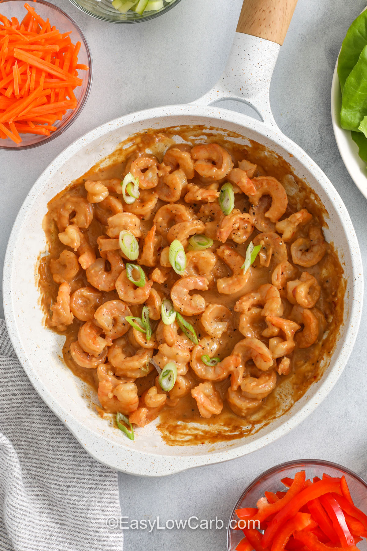 cooking shrimp in sauce to make Shrimp Lettuce Wraps