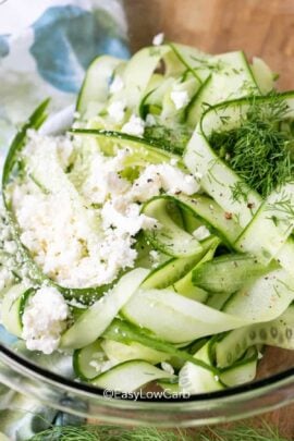 cucumber feta salad in a clear bowl.