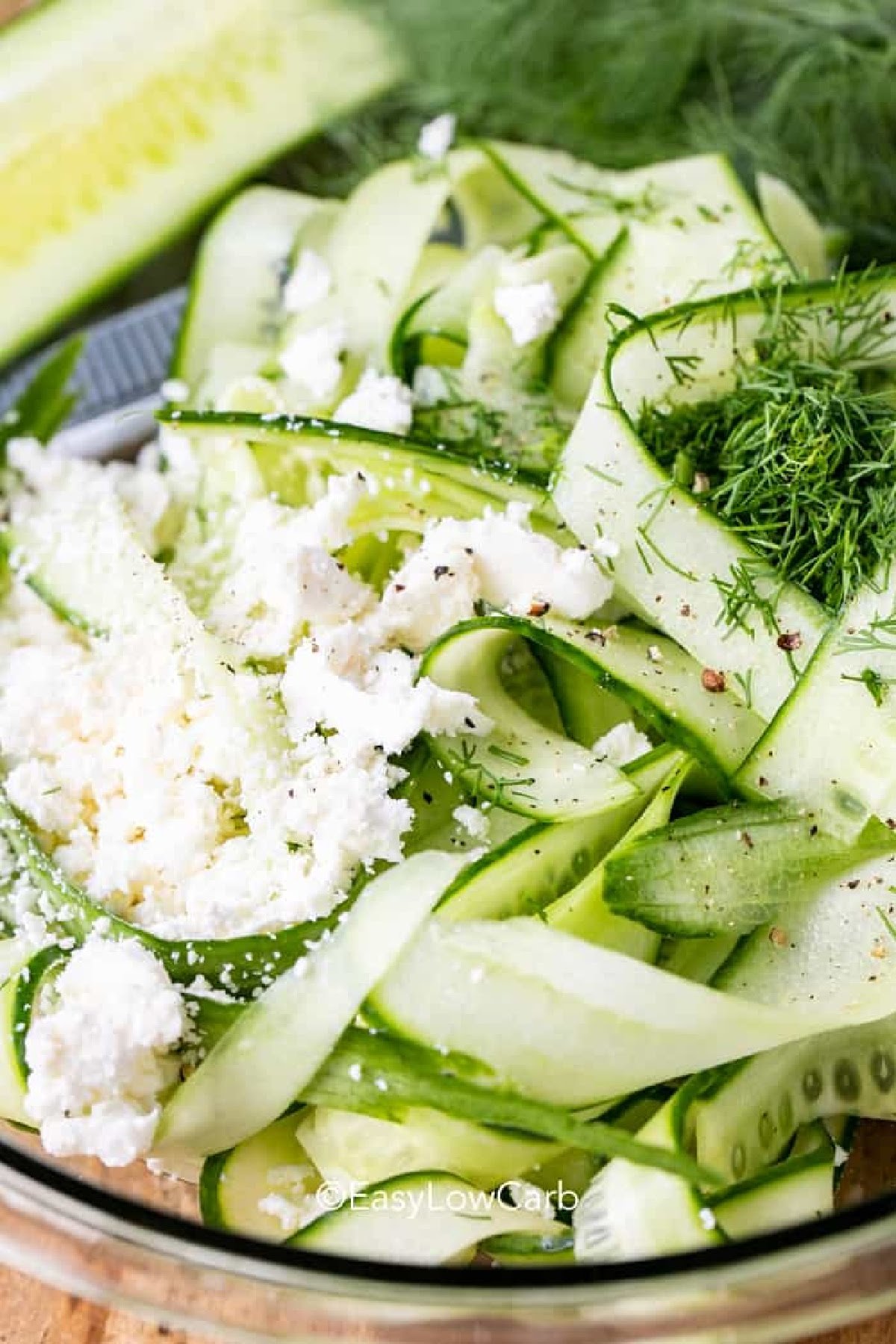 closeup of Cucumber Feta Salad in a bowl prepped before dressing