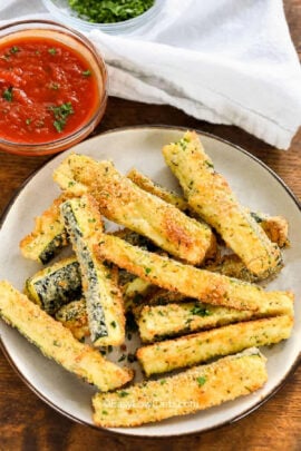 plated Baked Zucchini Fries with marinara sauce