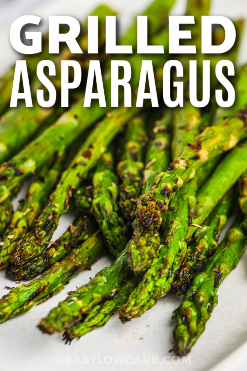 Try this grilled asparagus recipe for a quick and fresh side dish that’s bursting with flavor. The asparagus is lightly seasoned with garlic and lemon, then grilled until charred just right. Top with parmesan cheese or crumbled bacon for the best bite. Easy asparagus on the grill works great with steak, chicken, or anything roasted or grilled. #easylowcarb grilled asparagus with text