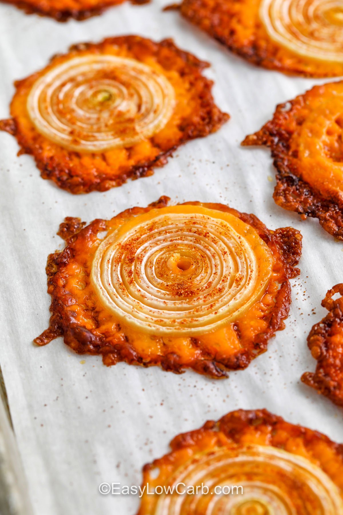 close up of Onion Cheese Chips on a sheet pan