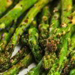 close up of grilled asparagus with text