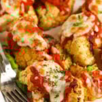 crispy Cauliflower Parmesan on a plate with a fork