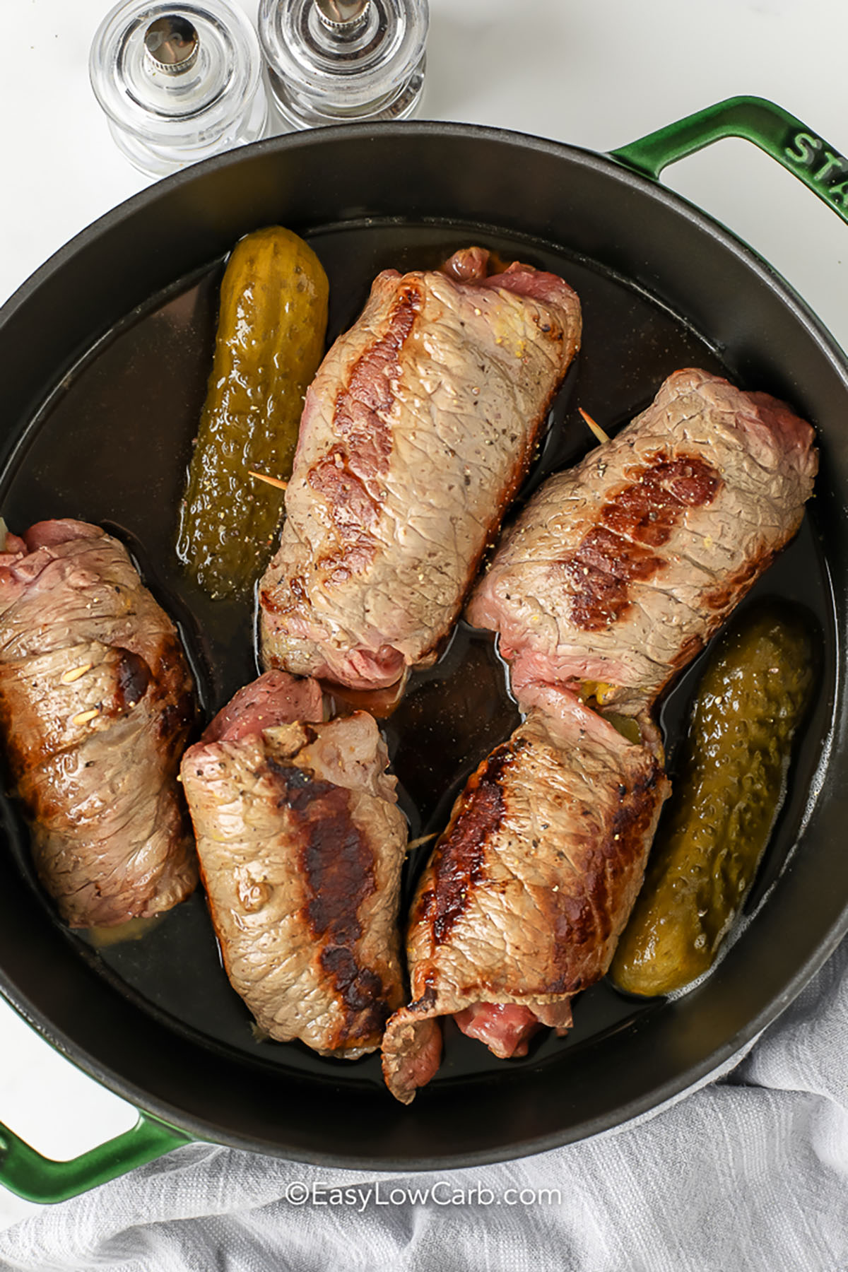 cooking stuffed beef rolls to make Beef Rouladen