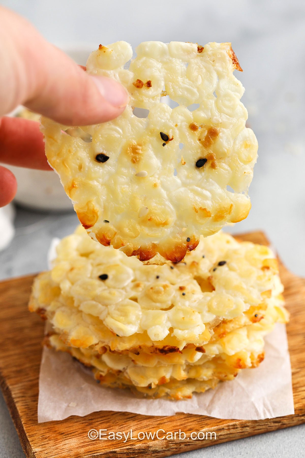 taking a Cottage Cheese Chips Recipe out of a pile