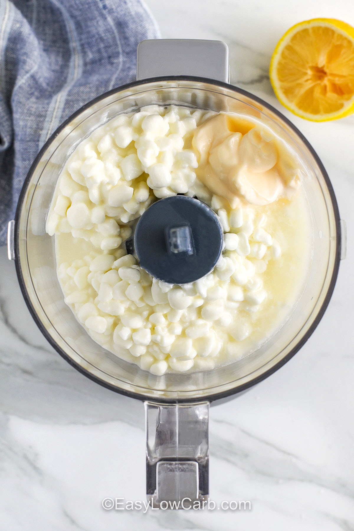 adding ingredients to food processor to make Cottage Cheese Ranch Dip