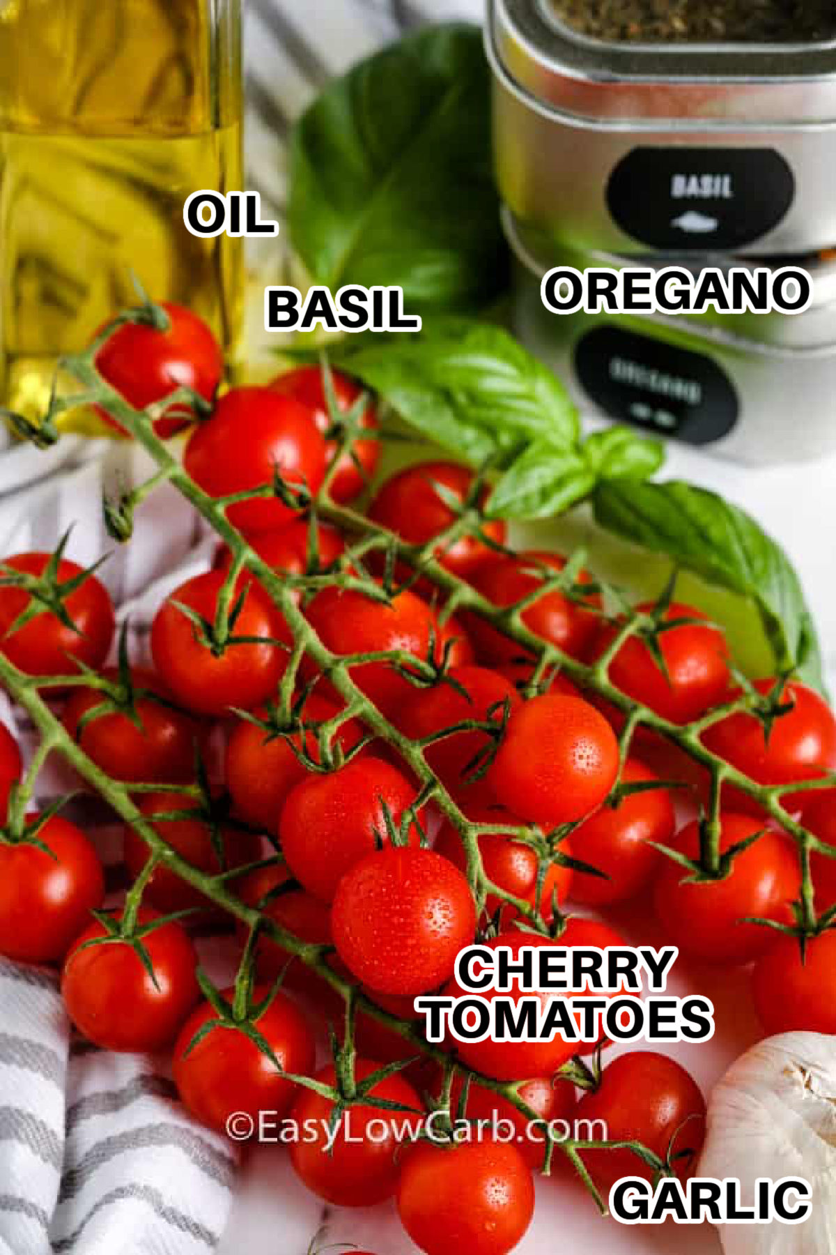 oil , basil , oregano , cherry tomatoes and garlic with labels to make Cherry Tomato Salad