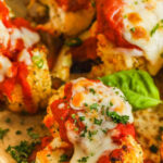 close up of baked Cauliflower Parmesan on a sheet pan with a title