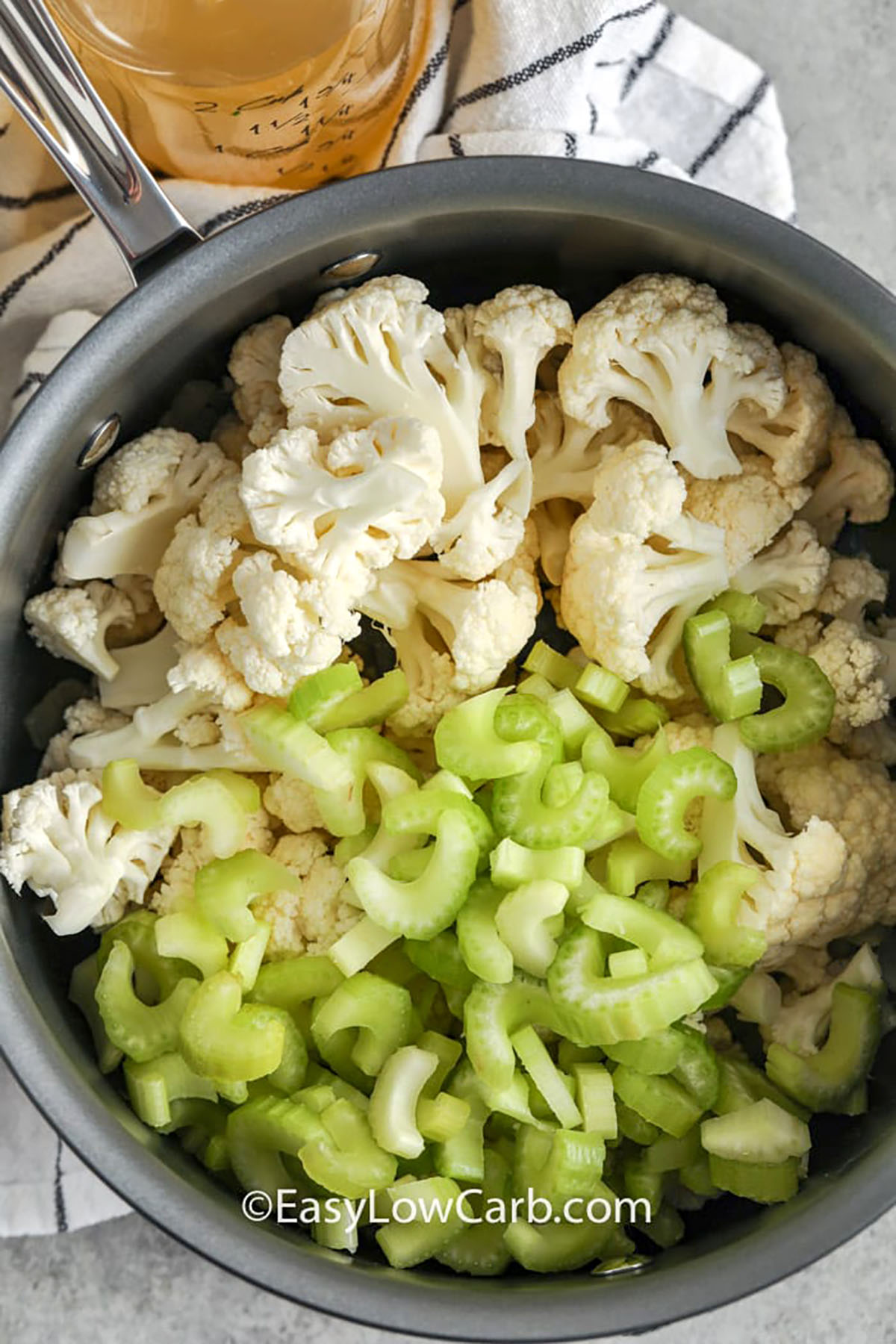 cauliflower and celery in pot to make Creamy Cauliflower Soup