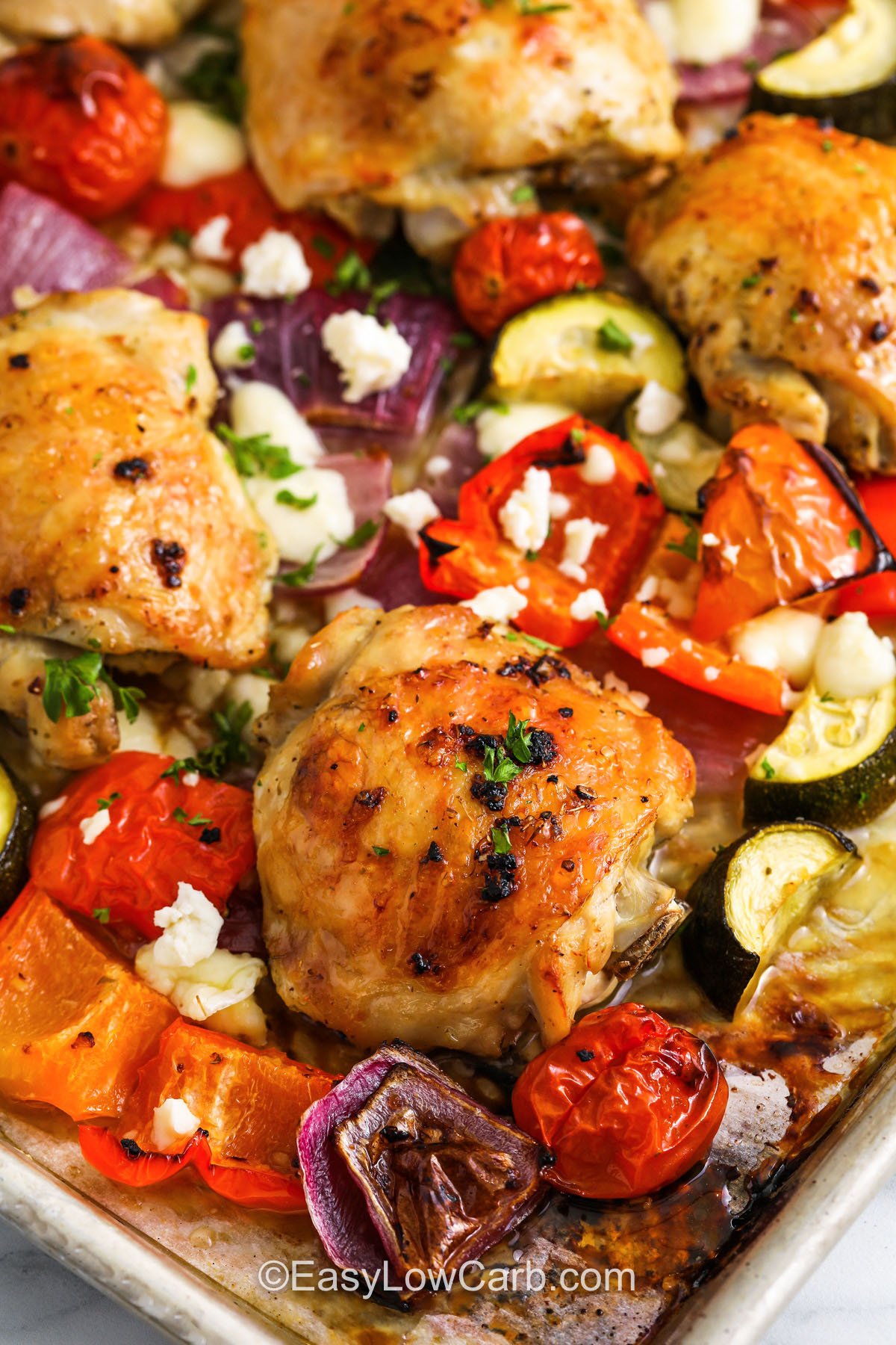 close up of Greek Sheet Pan Chicken and veggies