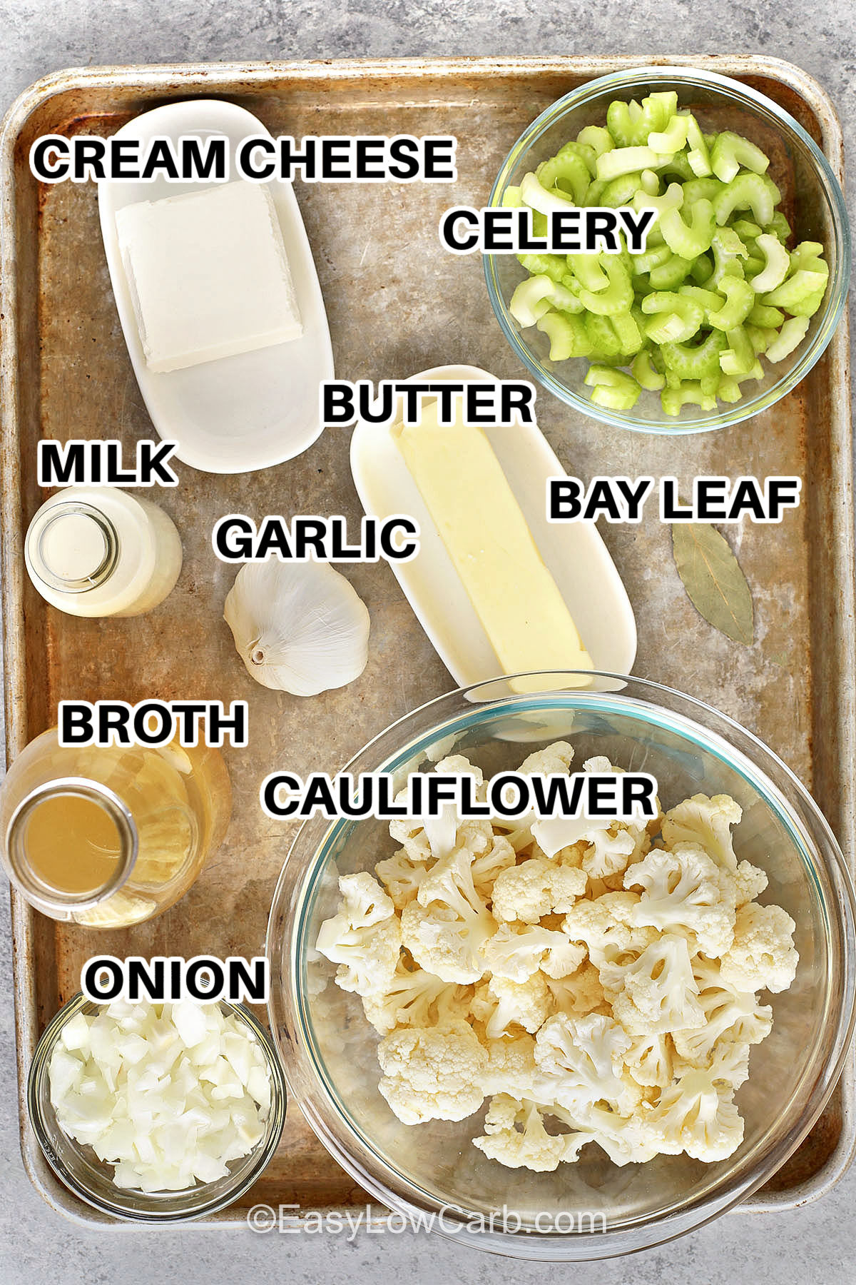 cream cheese , celery , butter , garlic , bay leaf , milk , broth , cauliflower , onion with labels to make Creamy Cauliflower Soup