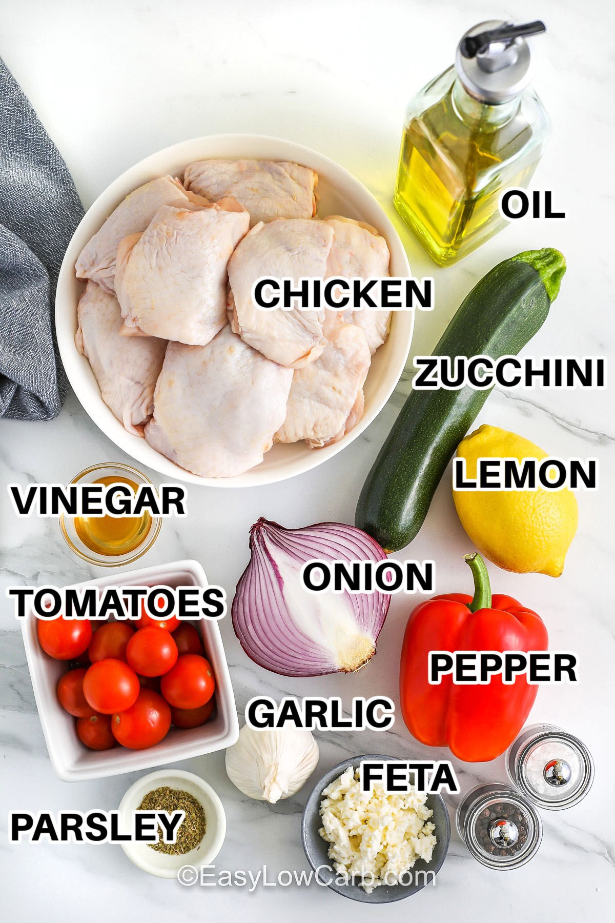 chicken , oil , zucchini , lemon , pepper , onion , vinegar , tomatoes , parsley , garlic , feta , salt and pepper with labels to make Greek Sheet Pan Chicken