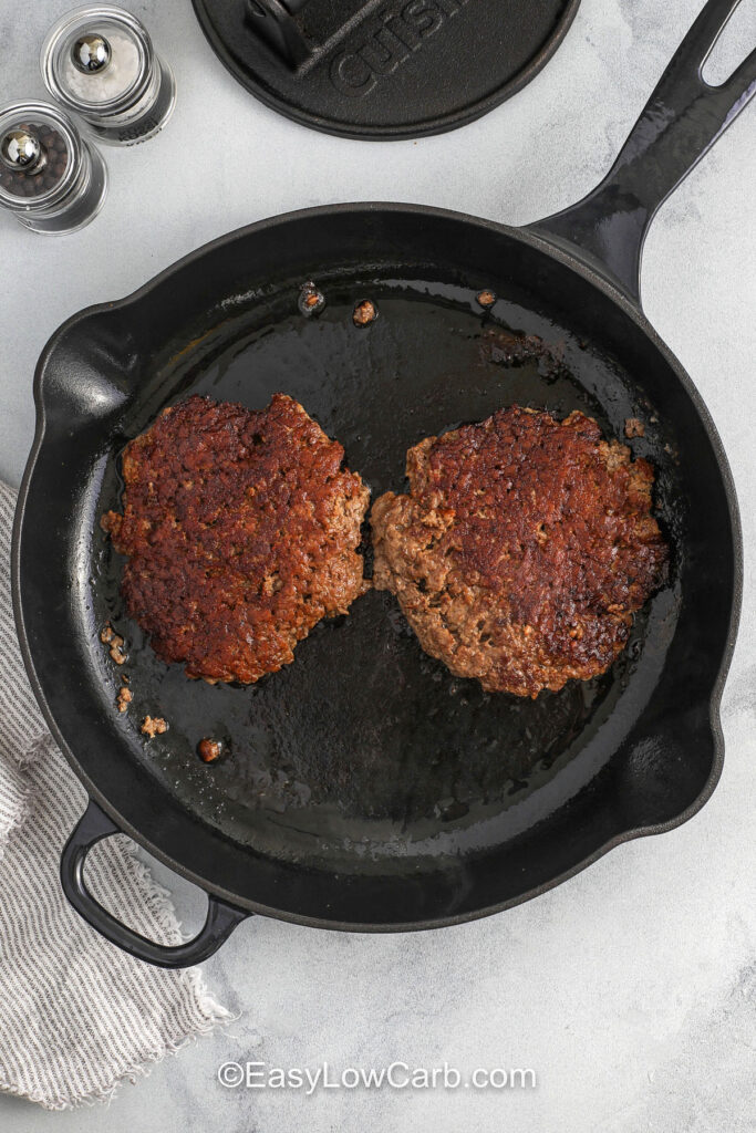 cooked burgers in a pan to make Lettuce Wrapped Burger