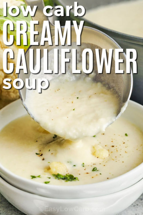 low carb Creamy Cauliflower Soup in a ladle and in a bowl with writing