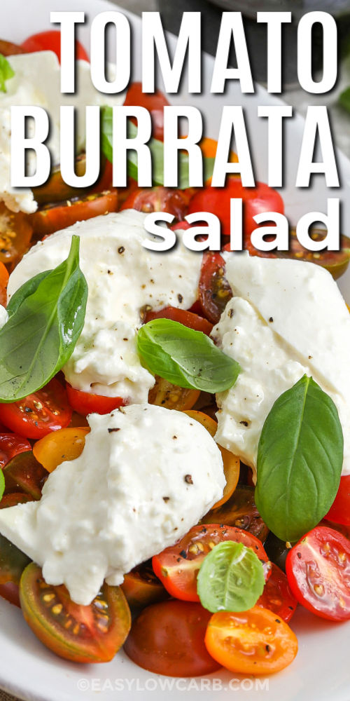 Tomato burrata salad is a refreshing way to enjoy seasonal produce with minimal effort. Grape or cherry tomatoes pair beautifully with rich, creamy burrata, while fresh basil adds a burst of herbaceous flavor. Just a splash of olive oil and optional balsamic vinegar make this dish delish. It's light, low-carb, and incredibly satisfying. This is perfect for summer gatherings or solo meals. #easylowcarb close up of Tomato Burrata Salad with writing