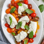 top view of Tomato Burrata Salad on a plate