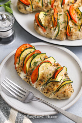 Hasselback chicken on a plate with a fork