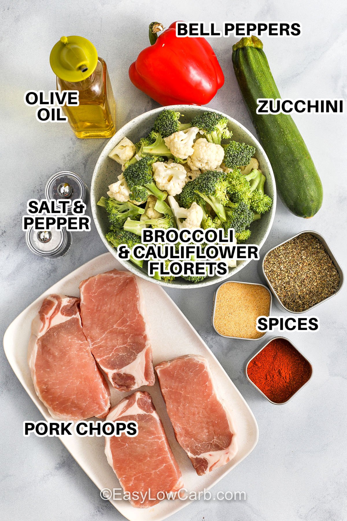 Sheet pan pork chops make dinner stress-free without sacrificing flavor. With just one bowl and one pan, you’ll prep a full meal featuring seasoned pork chops and crispy roasted vegetables. It’s low-carb, gluten-free, and customizable to whatever produce you have on hand. Add mushrooms, asparagus, or even Brussels sprouts to make it your own. #easylowcarb Ingredients to make sheet pan pork chops labeled: bell peppers, zucchini, olive oil, salt & pepper, broccoli and cauliflower florets, spices, and pork chops