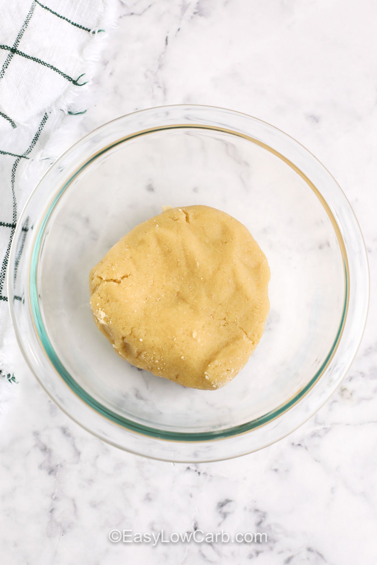 Enjoy this crunchy keto crackers recipe that’s packed with flavor and totally guilt-free. Using almond flour as a base keeps it low in carbs while delivering that crispy and satisfying texture. Make a batch in no time at all and customize with your favorite toppings. These are perfect for keto snacking, lunchboxes, or party trays. Real food, real crunch! #easylowcarb keto cracker ingredients in a bowl