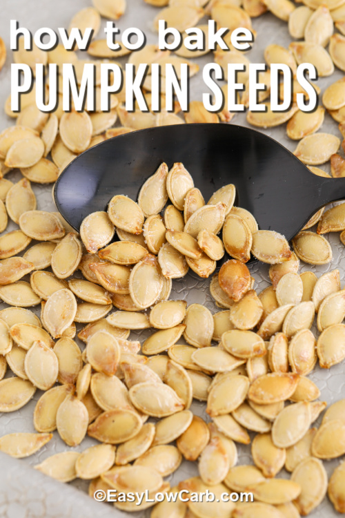 This easy recipe for baked pumpkin seeds yields a crunchy, salty snack that’s perfect for seasonal gatherings. The homemade seeds are roasted to golden perfection, bringing out their natural nutty flavor. Whether you prefer them spicy, sweet, or savory, these seeds make a delicious, healthy treat ideal for Thanksgiving or any cozy fall day. #easylowcarb Pumpkin seeds baked on a tray with a spoon and a title