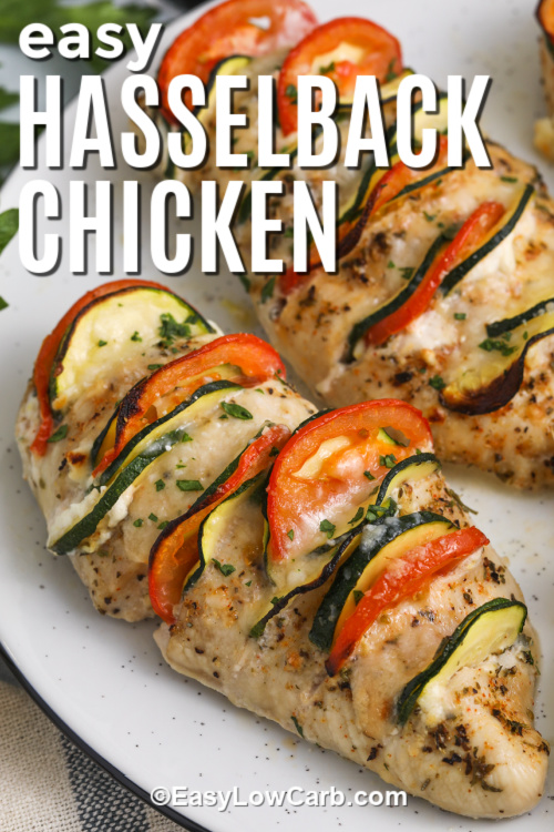 Hasselback chicken transforms plain chicken breasts into a cheesy, veggie-stuffed delight. Each cut is filled with a blend of cream cheese, lemon zest, and tender slices of zucchini and tomato. It’s low in carbs, high in flavor, and perfect for impressing guests without much effort. This baked dish comes together fast, and the oven does all the hard work for you. Easy, healthy, and delicious! #easylowcarb Hasselback chicken on a plate with a title