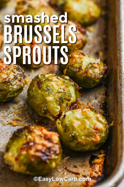 Smashed Brussel Sprouts Recipe baked on a baking sheet with a title