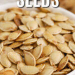 A bowl of baked pumpkin seeds with a title