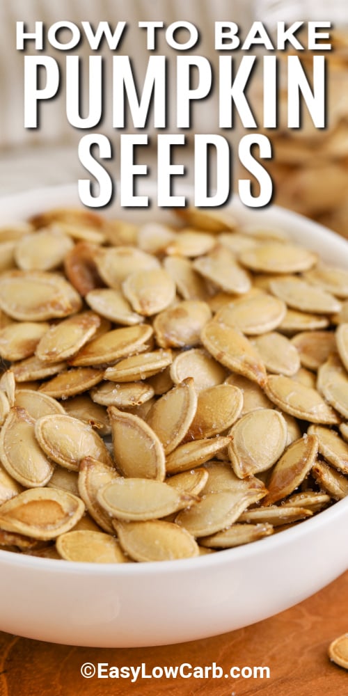 Baked pumpkin seeds are an easy, homemade snack that’s perfect for the Thanksgiving or Halloween season. These crunchy seeds are tossed with olive oil and salt for a savory and salty flavor that complements any autumn gathering. Their roasted, nutty taste makes them a wholesome treat you can enjoy anytime. Customize them with spices for a sweet or spicy twist to match your seasonal cravings. #easylowcarb A bowl of baked pumpkin seeds with a title