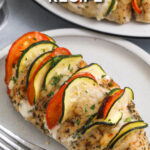 Hasselback chicken on a plate with a fork with a title