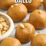 Keto peanut butter balls being served on a plate with a title