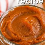 close up of a clear jar of pumpkin butter with a title