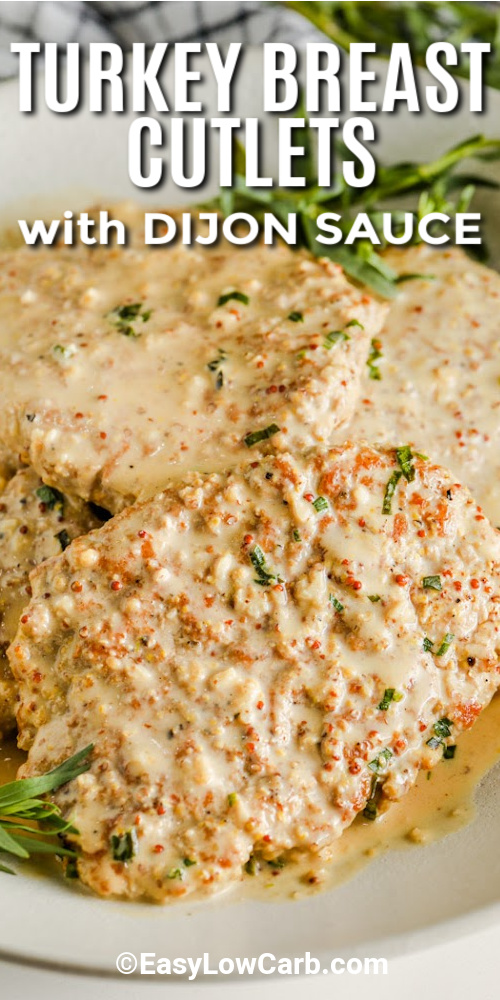 Turkey Breast cutlets on a serving tray topped with dijon sauce with a title