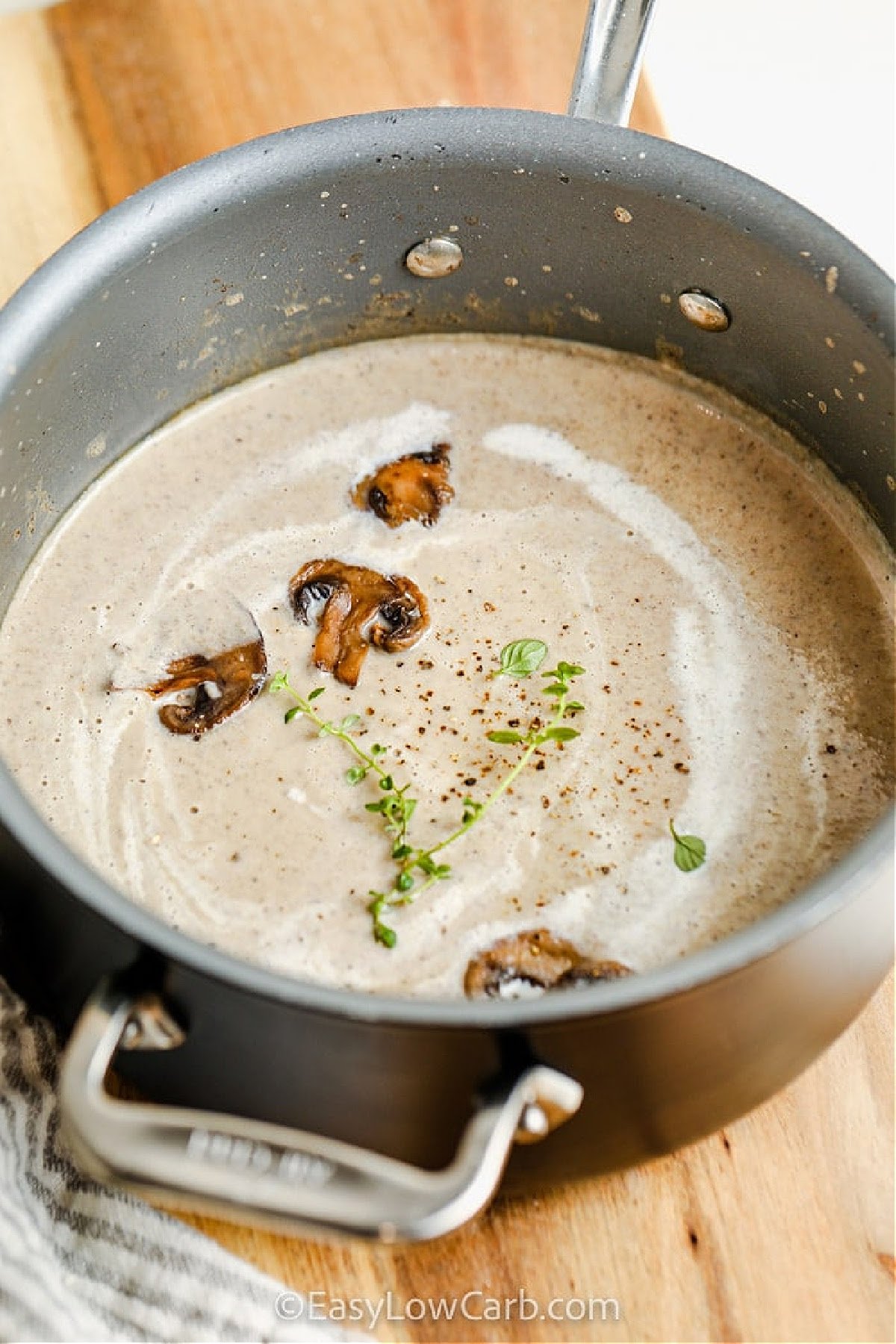This cauliflower mushroom soup becomes extra creamy and low in carbs with this easy version. Fresh garlic and thyme boost the flavor while a touch of cream cheese adds richness. Mushrooms are sautéed until tender, giving the soup that classic umami depth. Blending it all together makes a silky, hearty bowl that’s great on chilly days. An optional drizzle of cream takes it over the top. #easylowcarb Recipe for Cream of Mushroom Soup Recipe in the pot